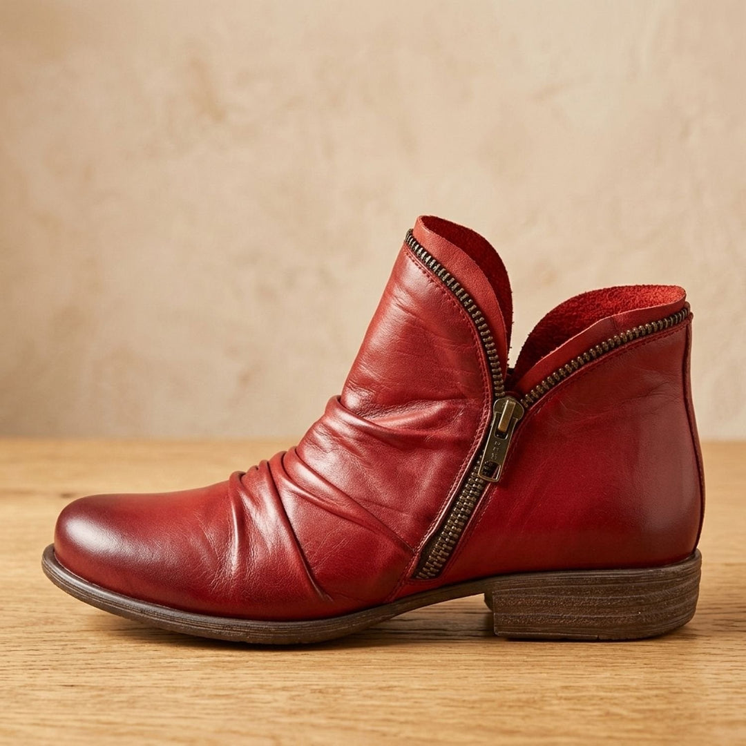 Dam ankelboots med bred passform, sidodragkedja och läderlook